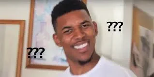 Man looking confused with question marks around his head