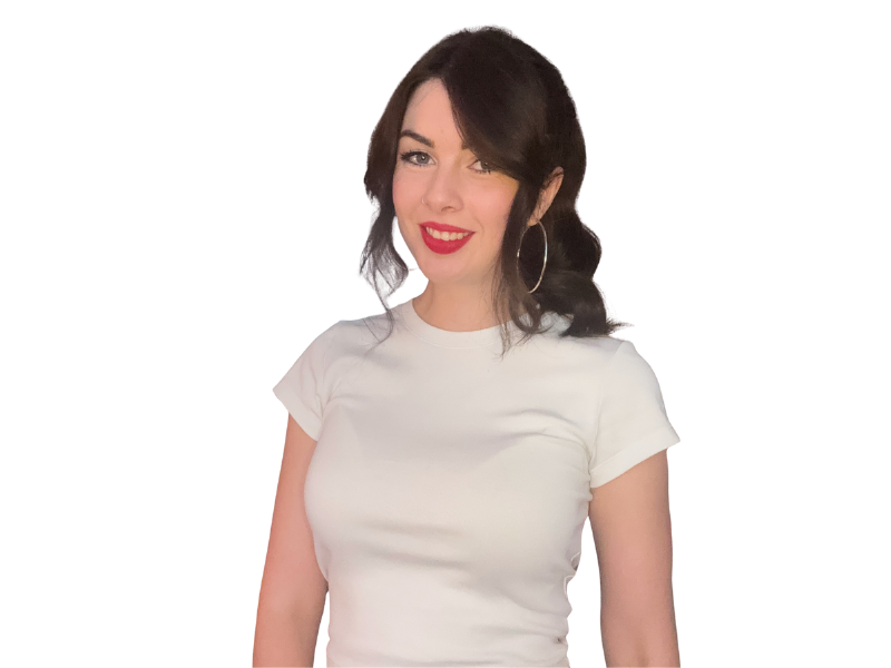 A young woman with dark wavy hair, red lipstick, and hoop earrings, smiling and wearing a white t-shirt.