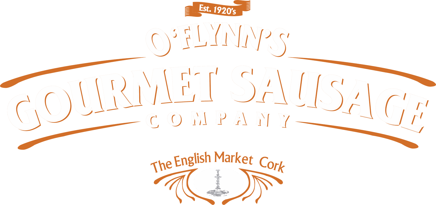 Logo for O'Flynn's Gourmet Sausage Company, established in the 1920s, featuring a decorative design with a sausage and ribbon banner, and text indicating it is from The English Market in Cork.