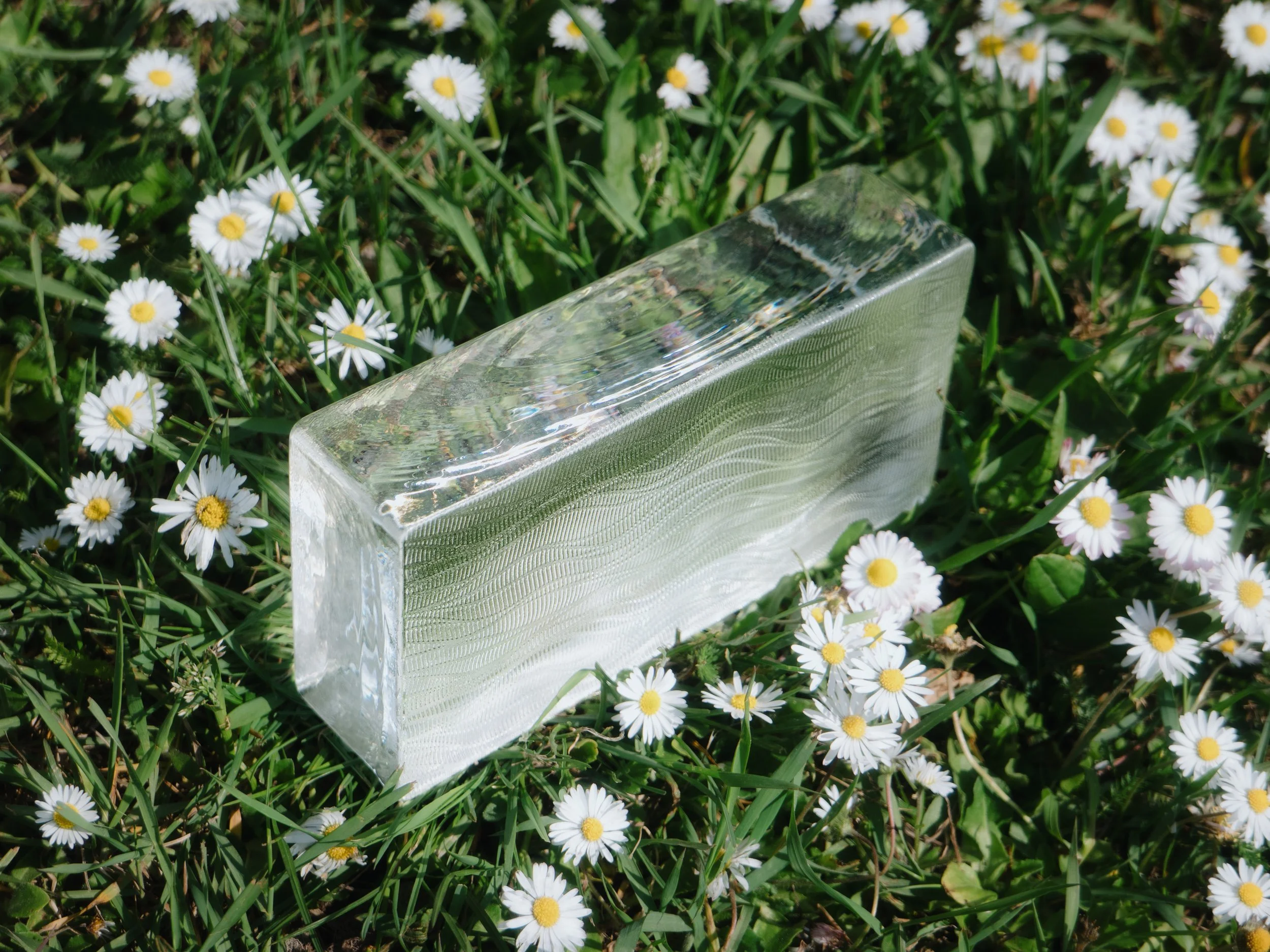 Solid glass brick with floral motif