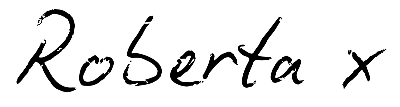 Handwritten text that says 'Roserta x' in black ink on a white background.