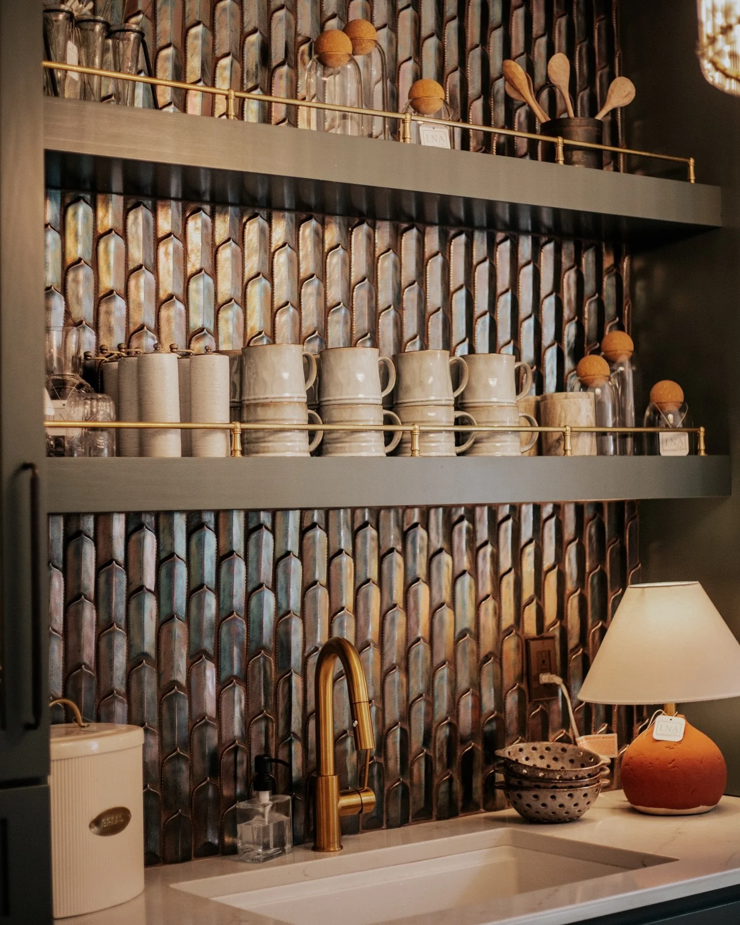 When designing this custom kitchenette, we wanted to create a space that felt deeply intentional, richly textured, and completely elevated.

Here is how we brought the vision to life:

The Color Palette: We painted the full custom cabinetry in a rich