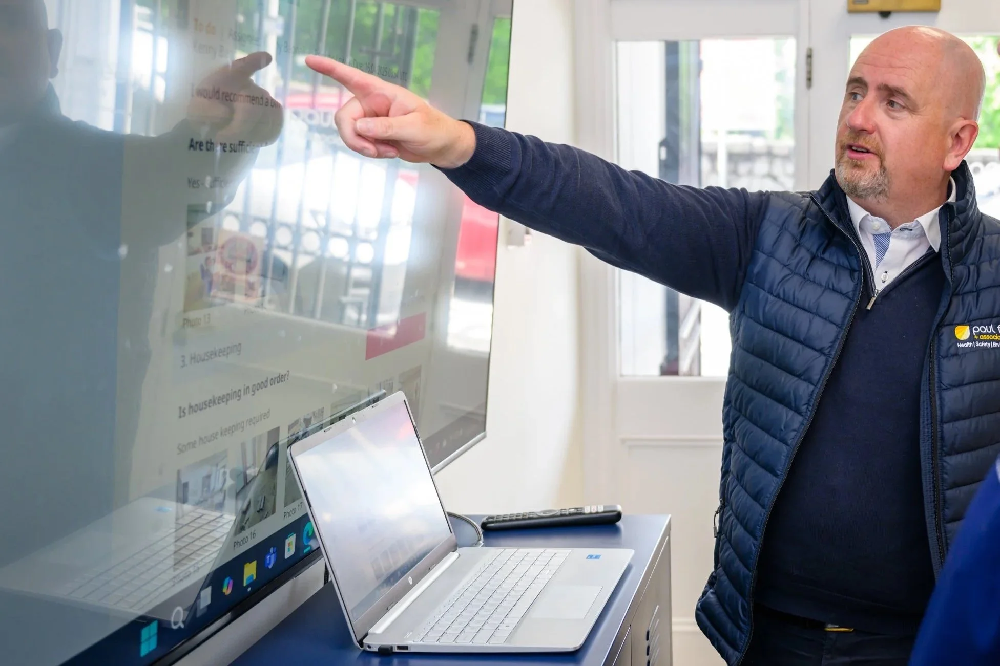 Paul Pointing towards Screen