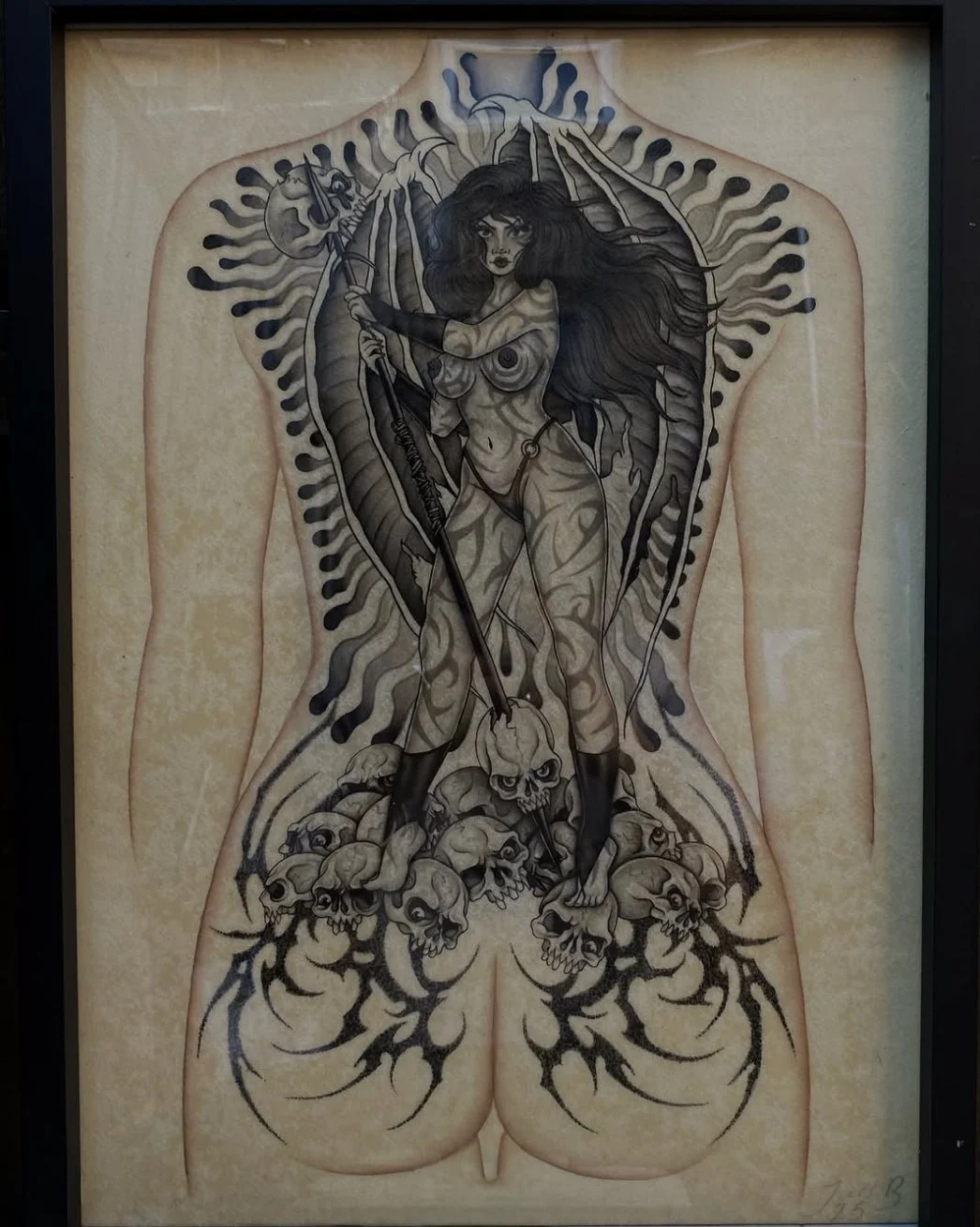 Tattoo design of a woman with long hair holding a bow and arrow, surrounded by skulls and dark abstract patterns on a human back.