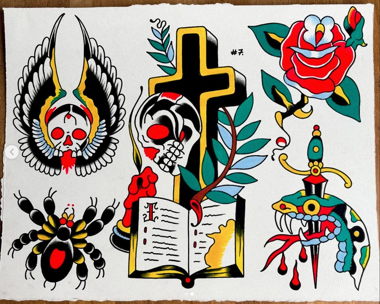 Tattoo art featuring black, red, yellow, blue, and green colors with skulls, a cross, a rose, a serpent, a spider, and an open book.