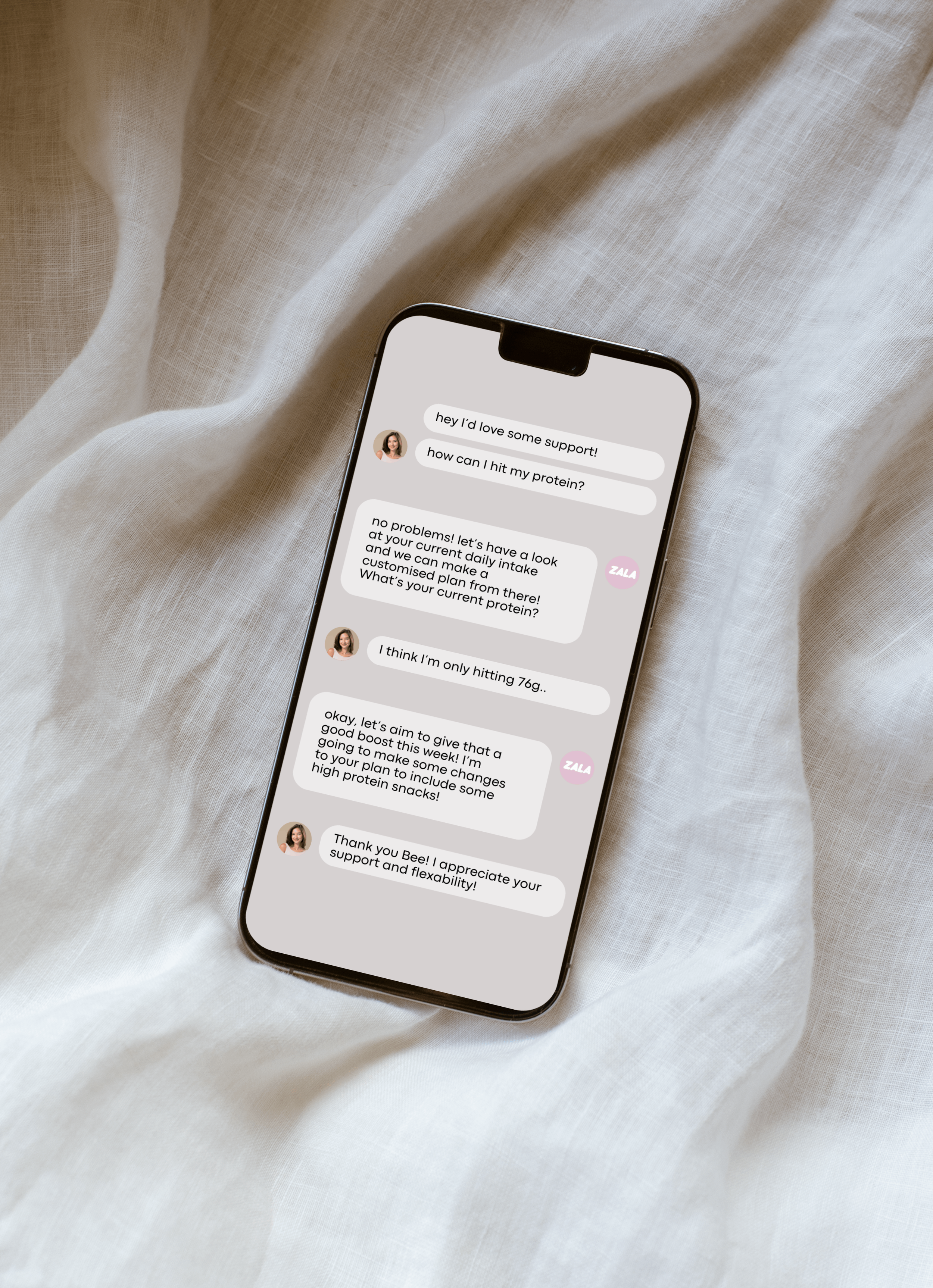 A smartphone displaying a chat conversation about health and nutrition, resting on a white fabric surface.