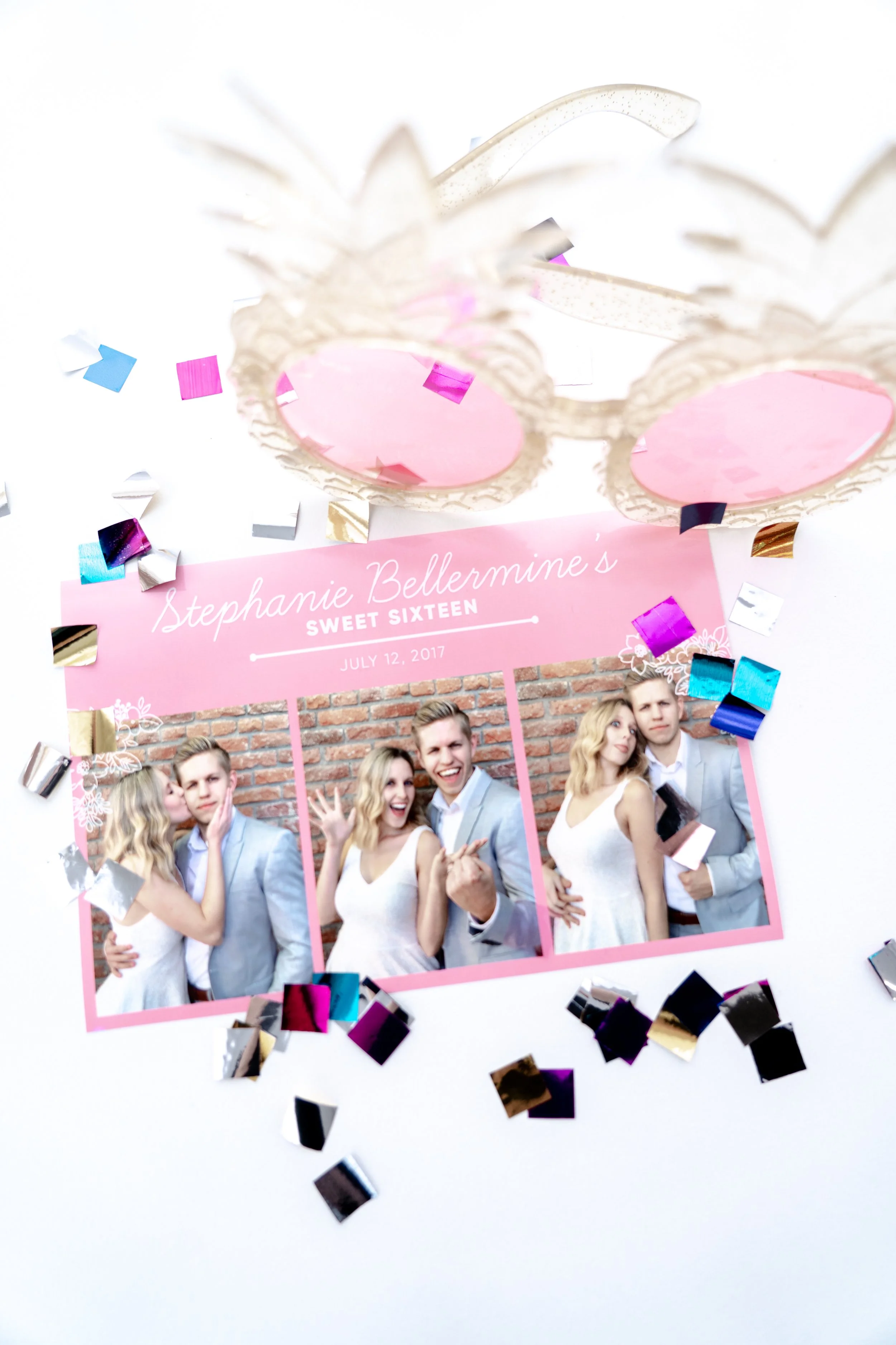 Photograph of a birthday celebration with a pink card displaying the name Stephanie Bellermine, celebrating her sixteenth birthday on July 12, 2017, surrounded by confetti and a pair of novelty sunglasses, with photos of her and friends.