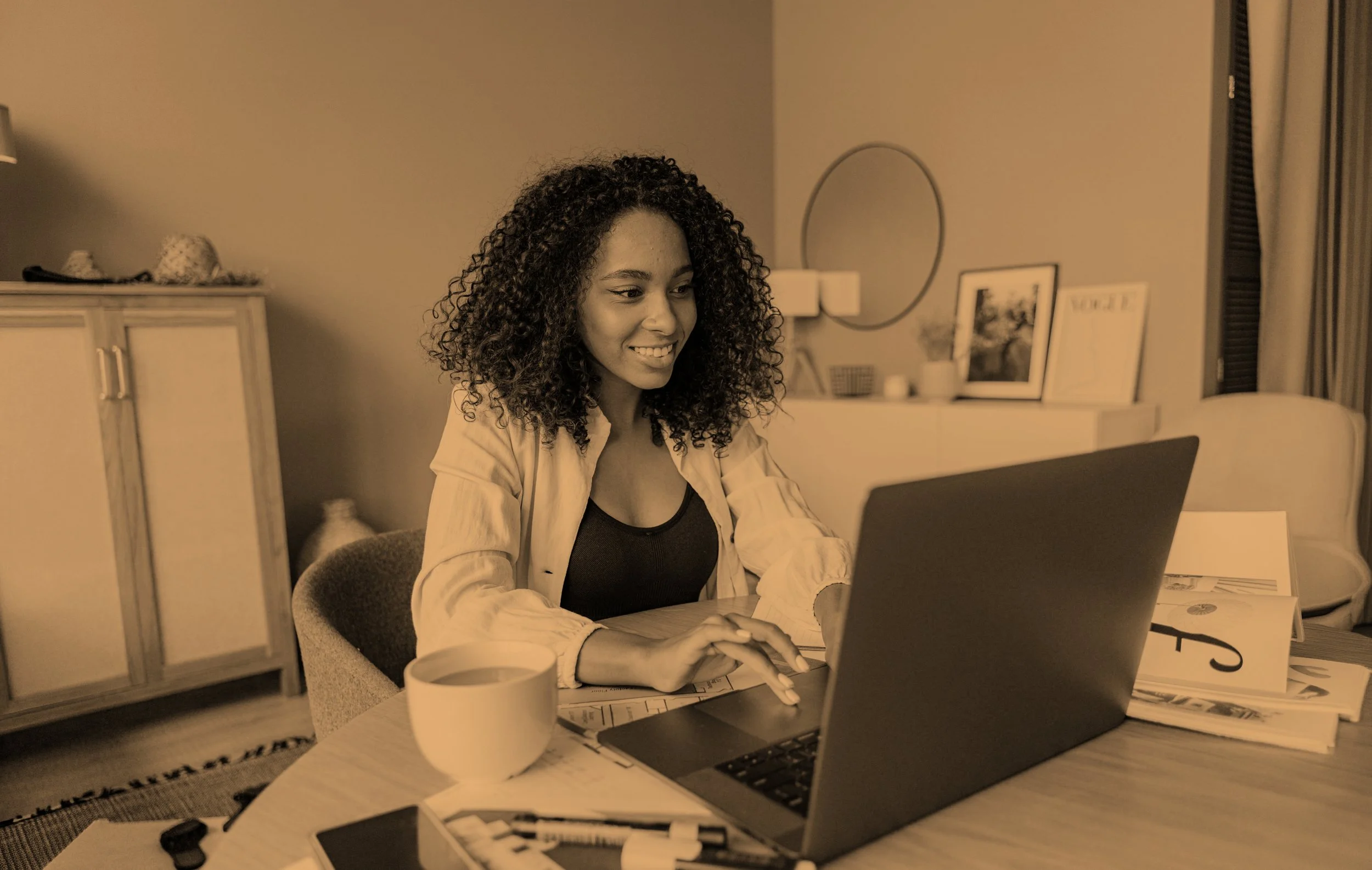 Photo one - Person at a computer (orange).jpg