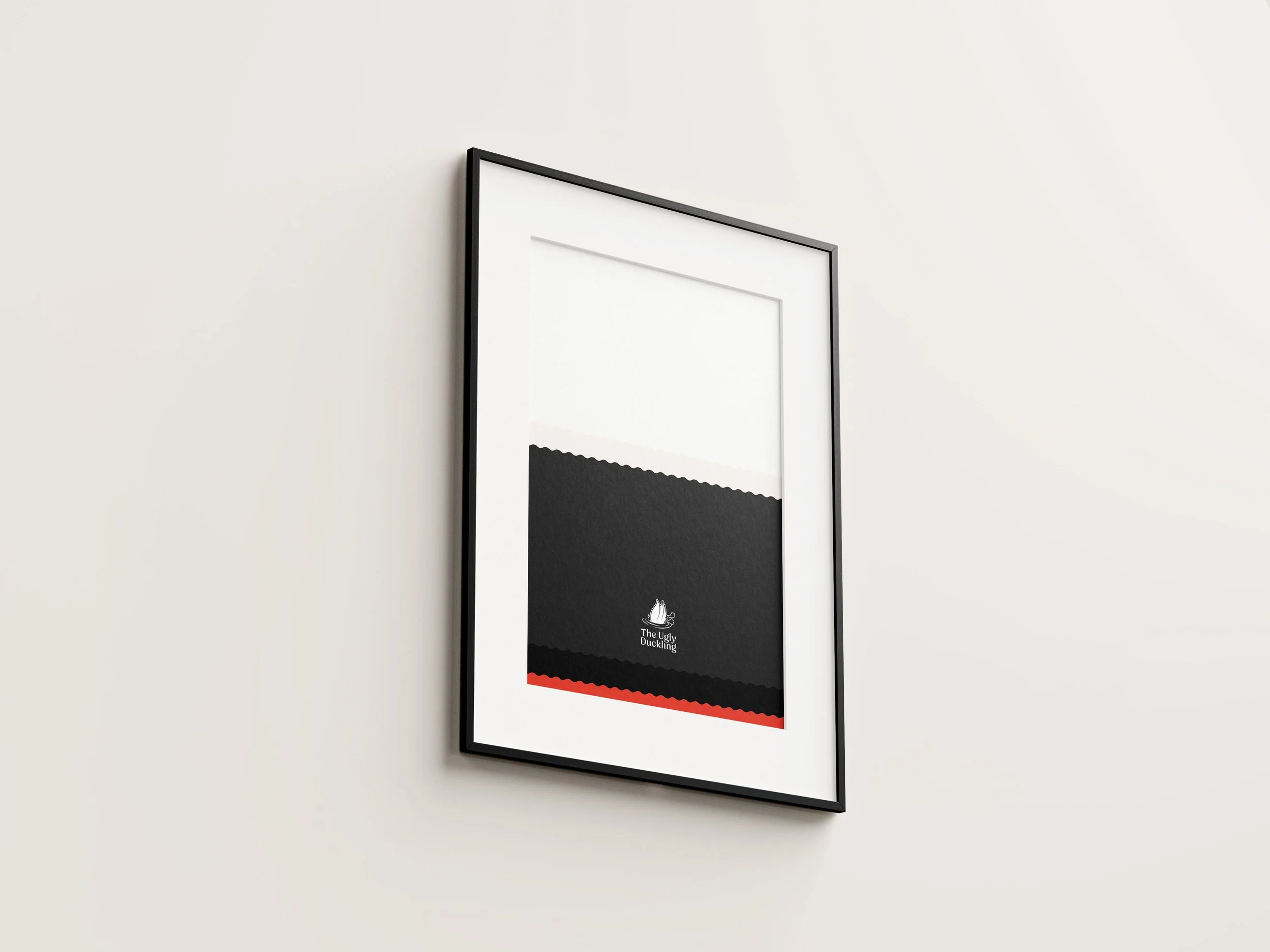 Framed black and white artwork with red accents on a white wall