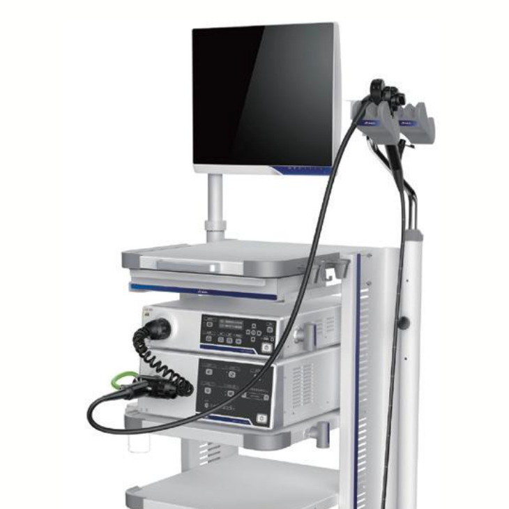 Medical equipment cart with monitor and various medical devices, likely used in a clinical or hospital setting.