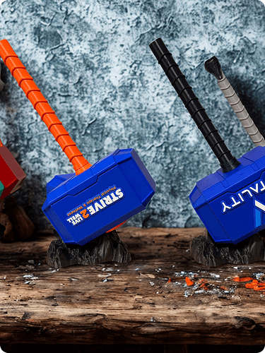 Two toy hammers with blue bodies and black and gray handles, placed on a wooden surface against a textured blue background.