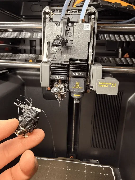 broken 3d printer hot end that mike off mm creative designs is holding for repair