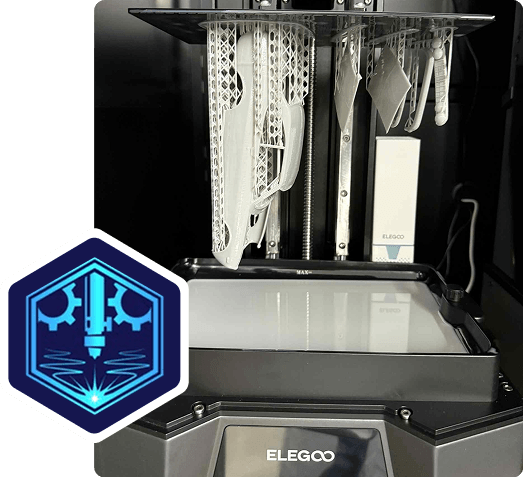Open ELEGOO resin 3D printer with hanging tools and a blue hexagonal-shaped mm creative designs logo in the bottom left corner.