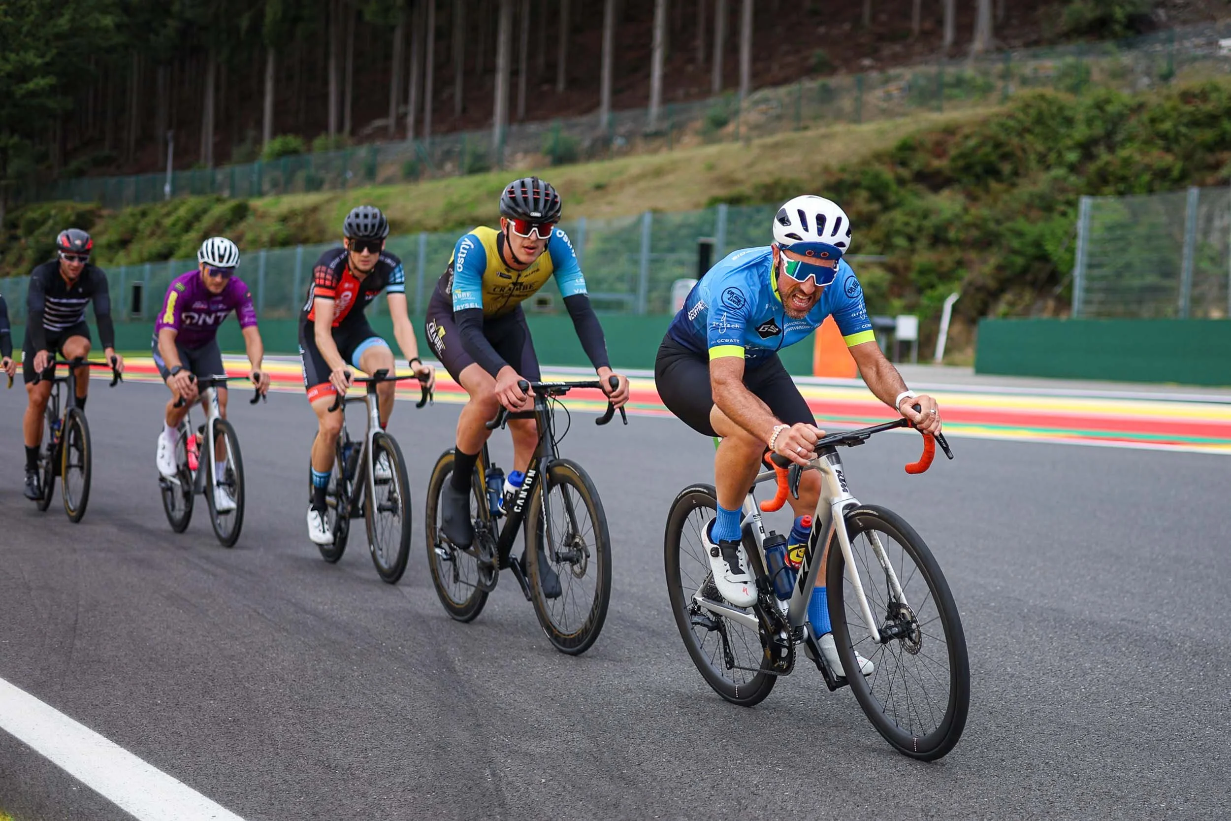 Group of cyclists riding on the SPA Francorschamp circuit