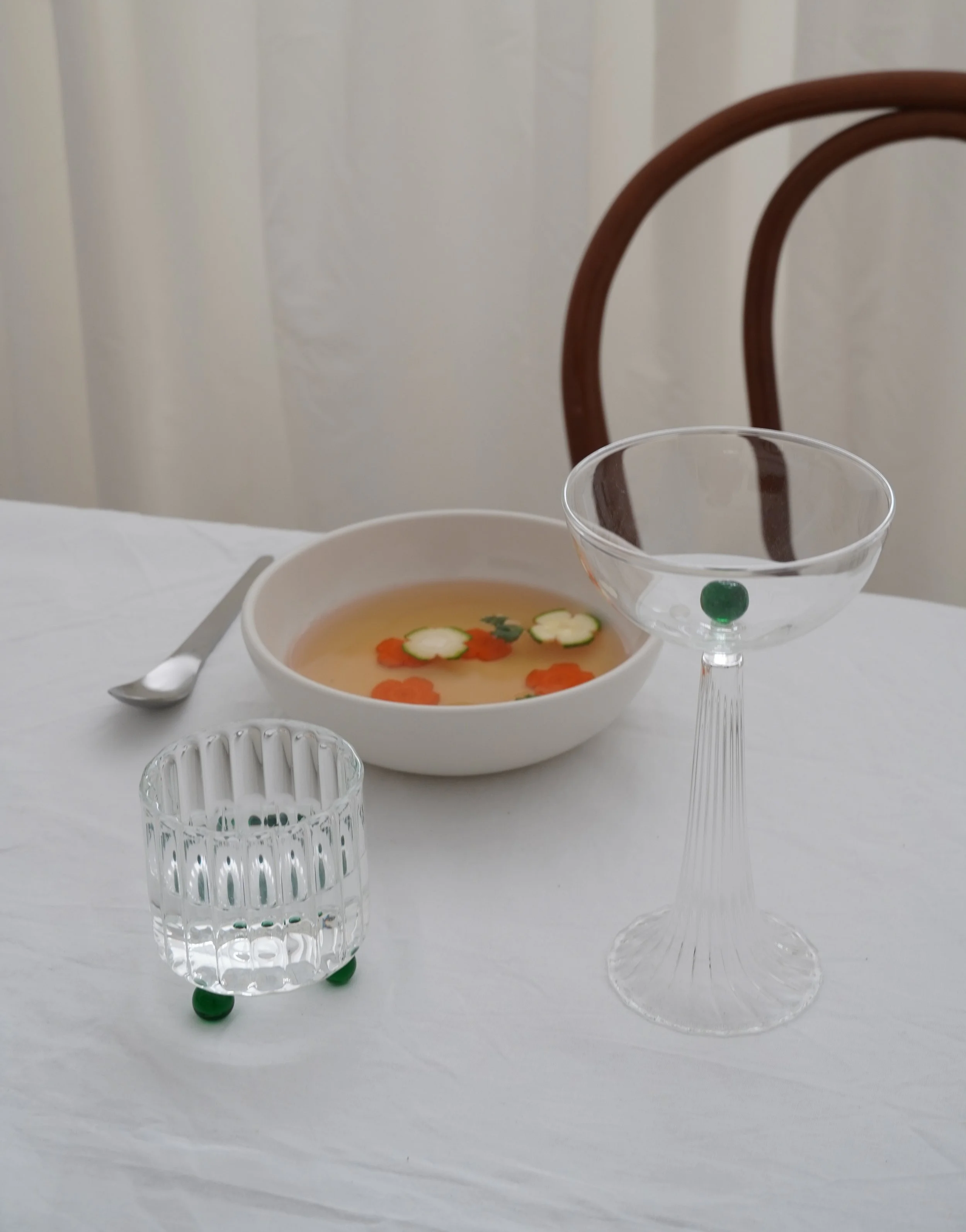 Table Setting with handmade glassware with green accents