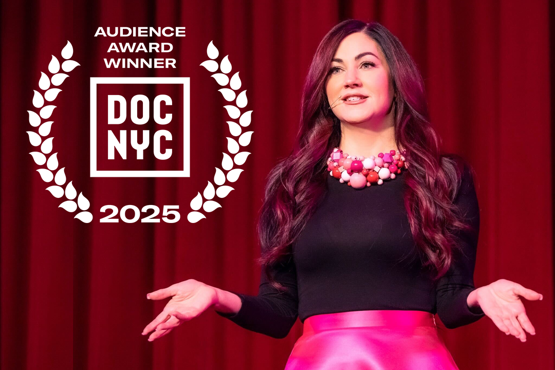 Cindy Eckert from The Pink Pill on stage delivering a speech