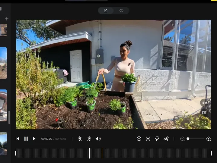 Editing video footage of a woman watering potted plants in a garden bed outside a house.