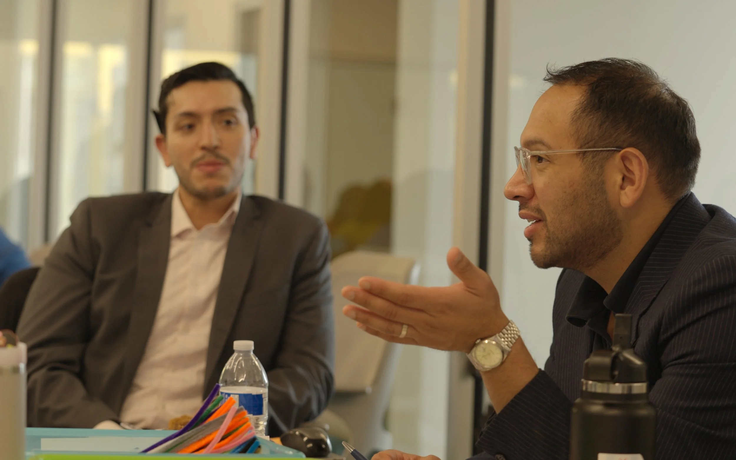 Two members of the co-design team talking