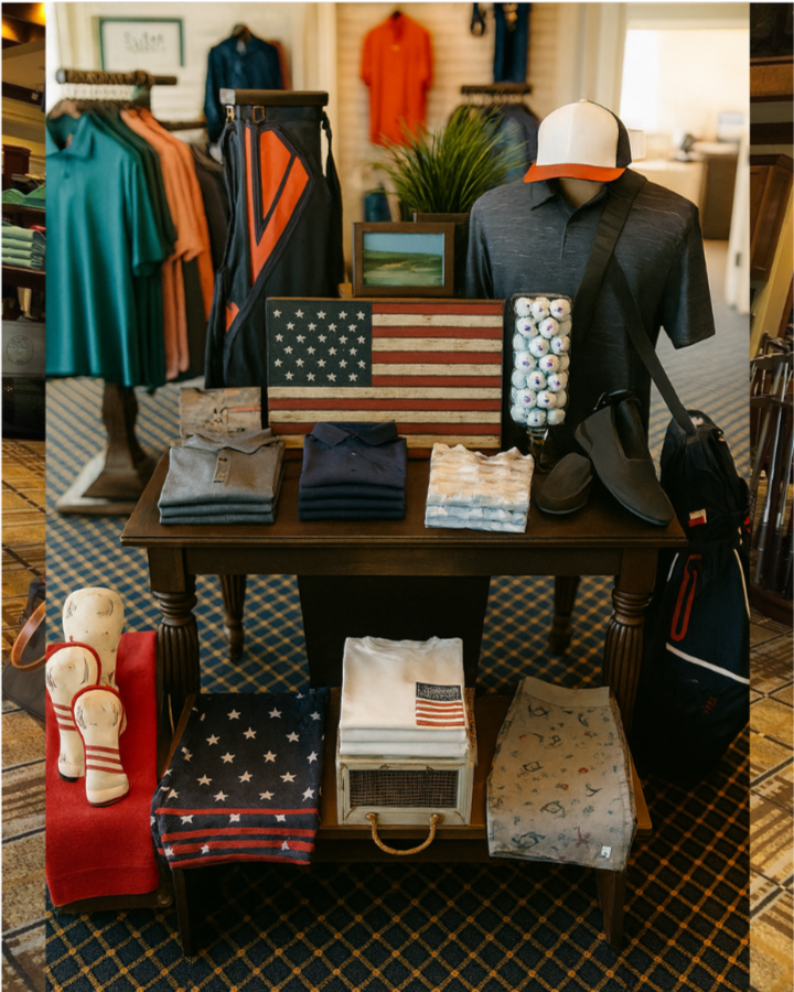 Display of patriotic-themed golf accessories, clothing, and footwear in a retail store, including hats, golf clubs, towels, golf balls, and clothing with American flag motifs.