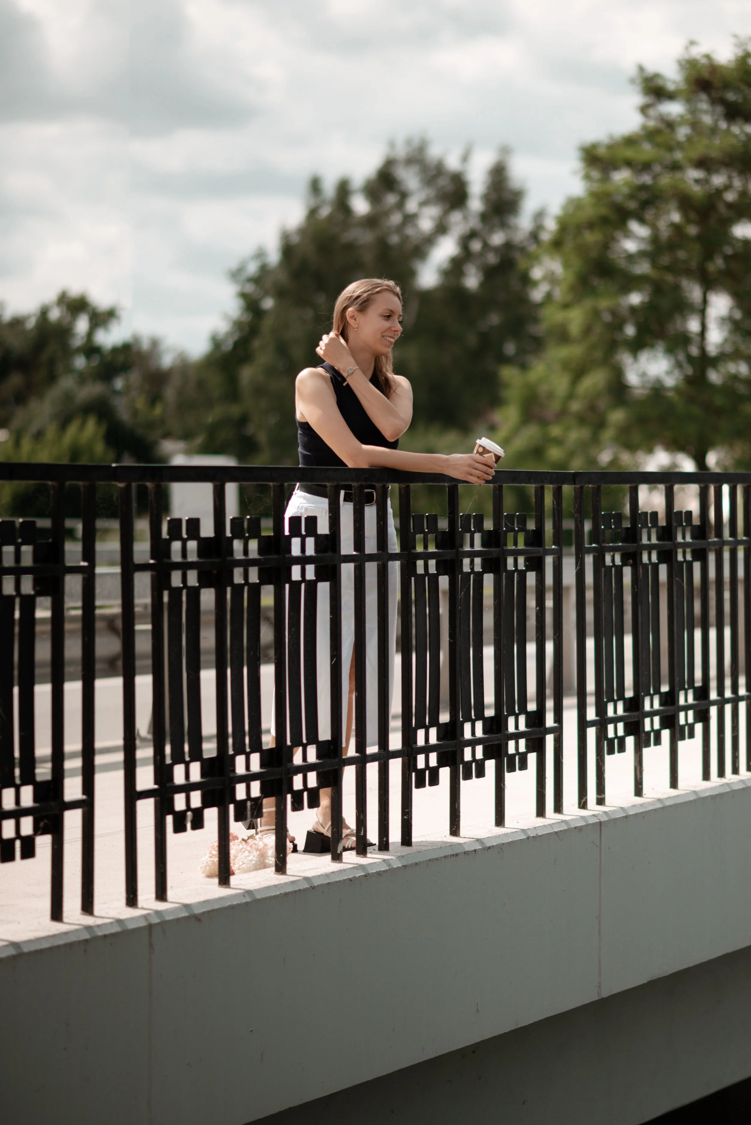 Woman holding cup aesthetic