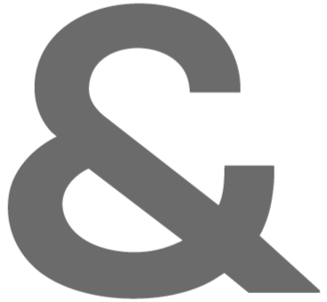Close-up of a large gray ampersand symbol.