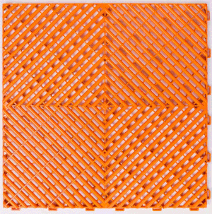 Close-up of an orange textured surface with a geometric pattern of intersecting diagonal lines creating diamond shapes.