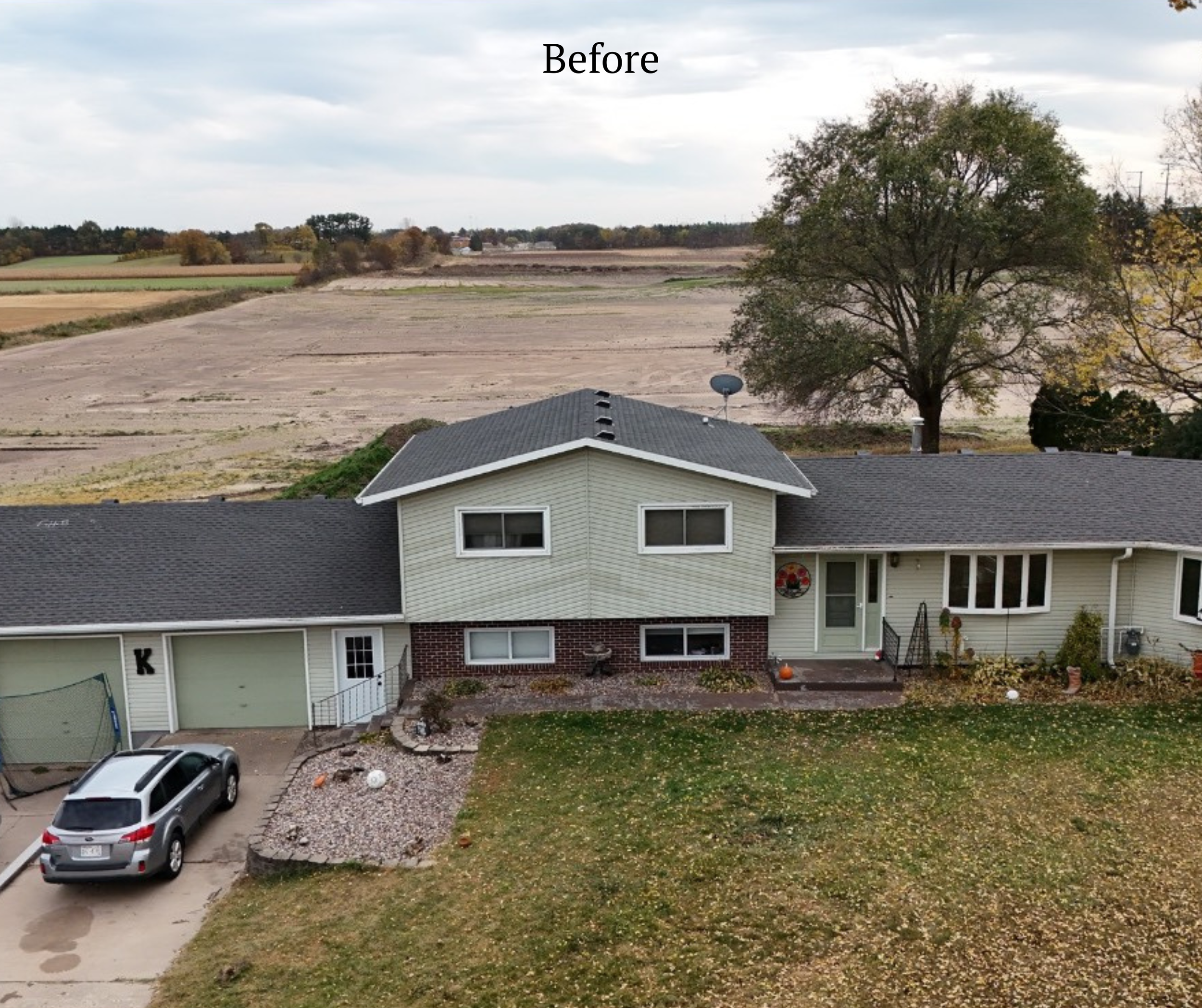 A two-story house with a driveway, a parked silver car, a small rock garden, and a yard with fallen leaves. There is a large tree behind the house and an open field in the background. The image is labeled 'Before' at the top.