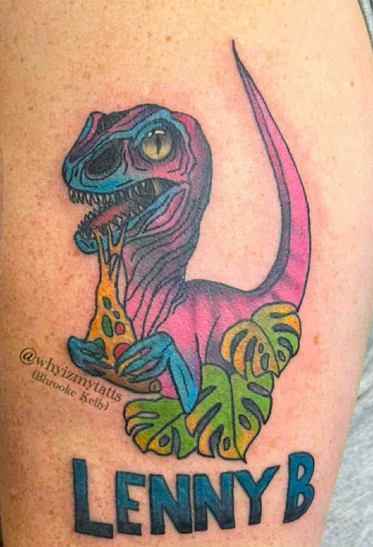 Colorful tattoo of a T-Rex dinosaur holding a leopard print vase with leaves, with the name 'Lenny B' below.