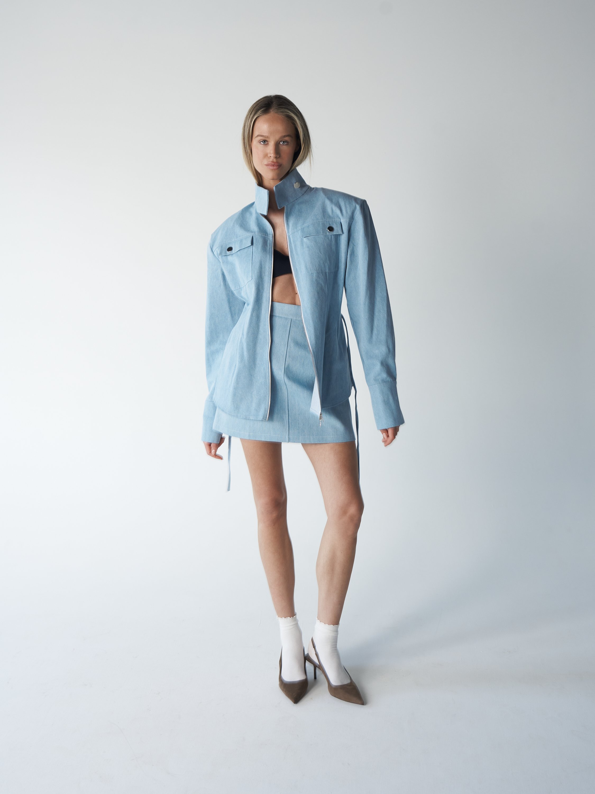 A-Line denim skirt is crafted from structured light-blue denim