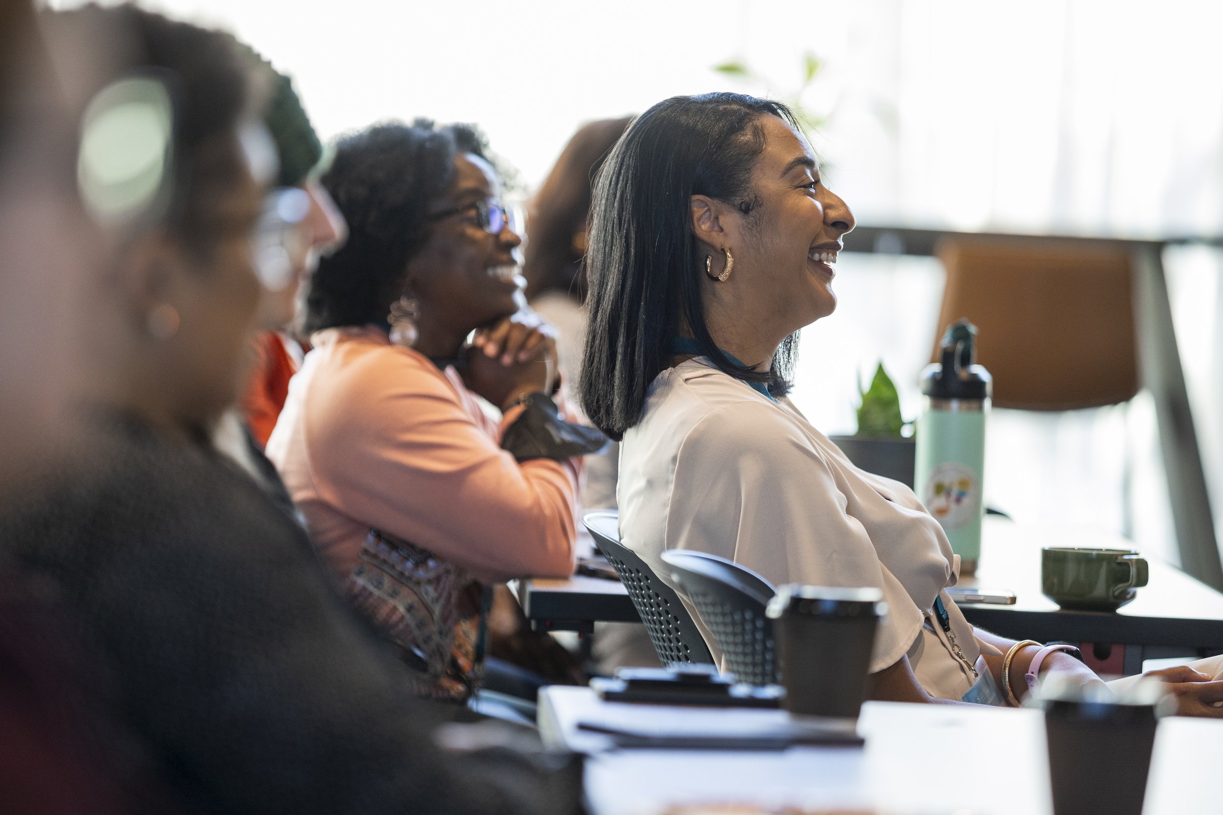 Small business owners sitting and smiling wide