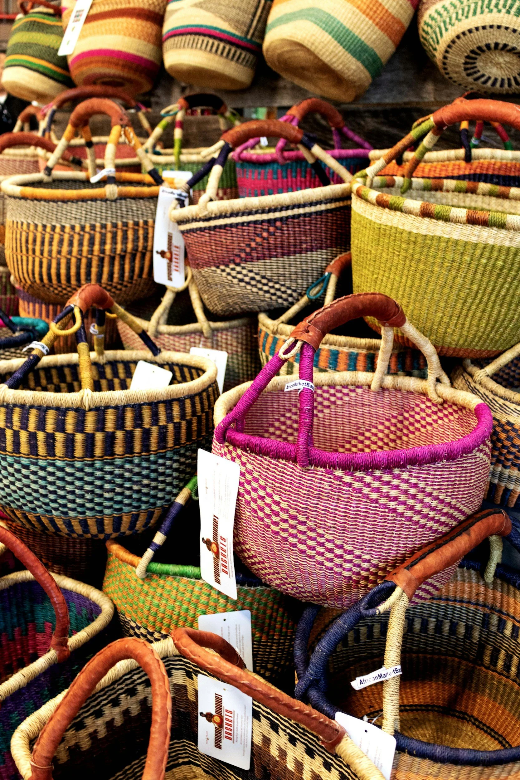 Colorful woven baskets on display at a market or store.