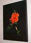 Painting of an orange flower with green leaves on a black background