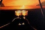Two glasses of champagne on a table with a sunset in the background.