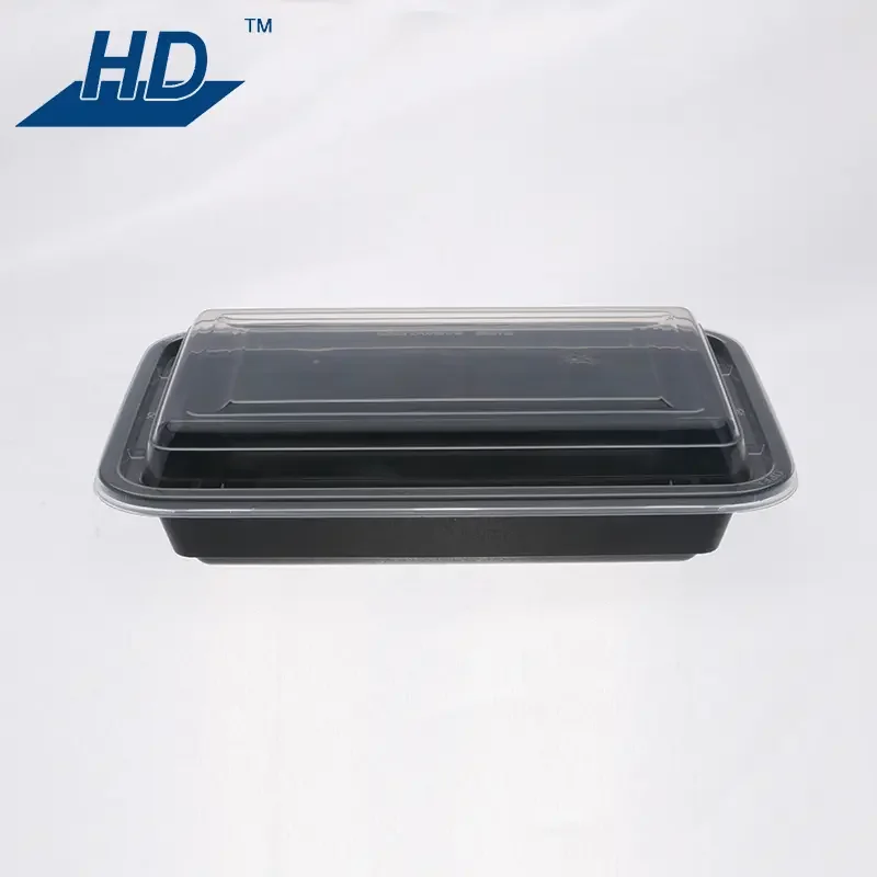 Black food tray with a clear plastic lid on a white background