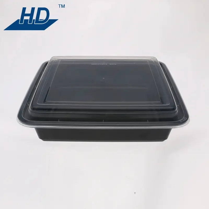 Black plastic food takeout container with a clear plastic lid on white background. HD logo visible in the top left corner.
