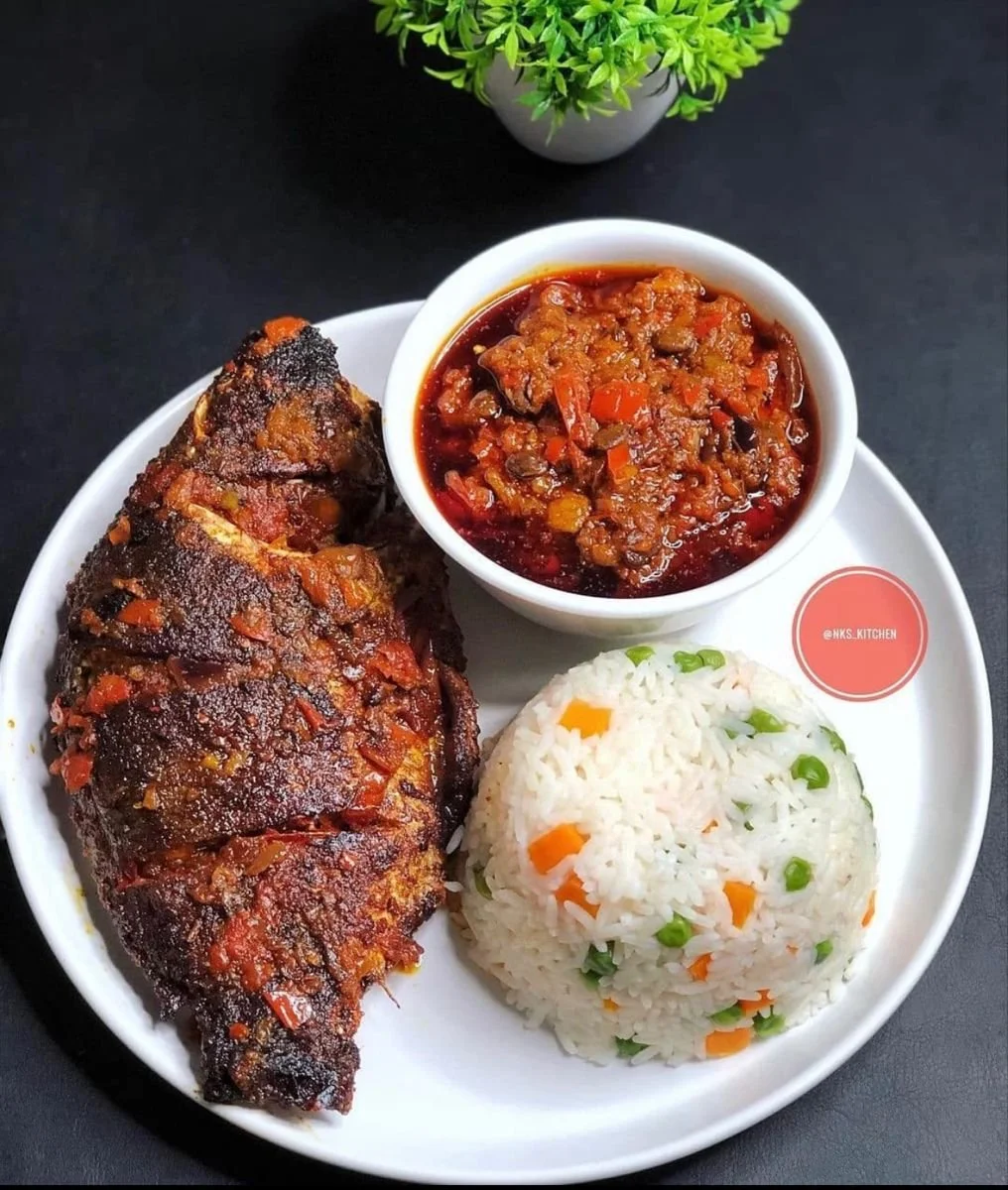 White rice, grilled fish, fried plantain and stew