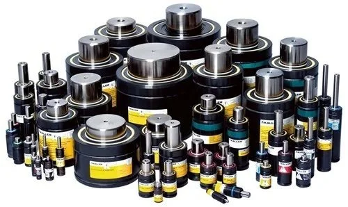 A collection of black cylindrical batteries of various sizes with metallic tops, arranged on a white surface.