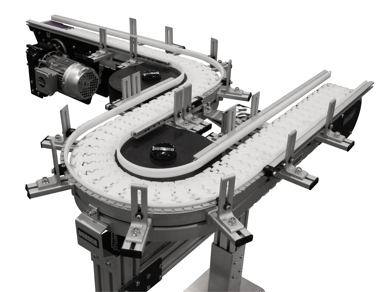 Automated conveyor system with white plastic chain links, metal rails, and black motor components used for material handling or manufacturing automation.