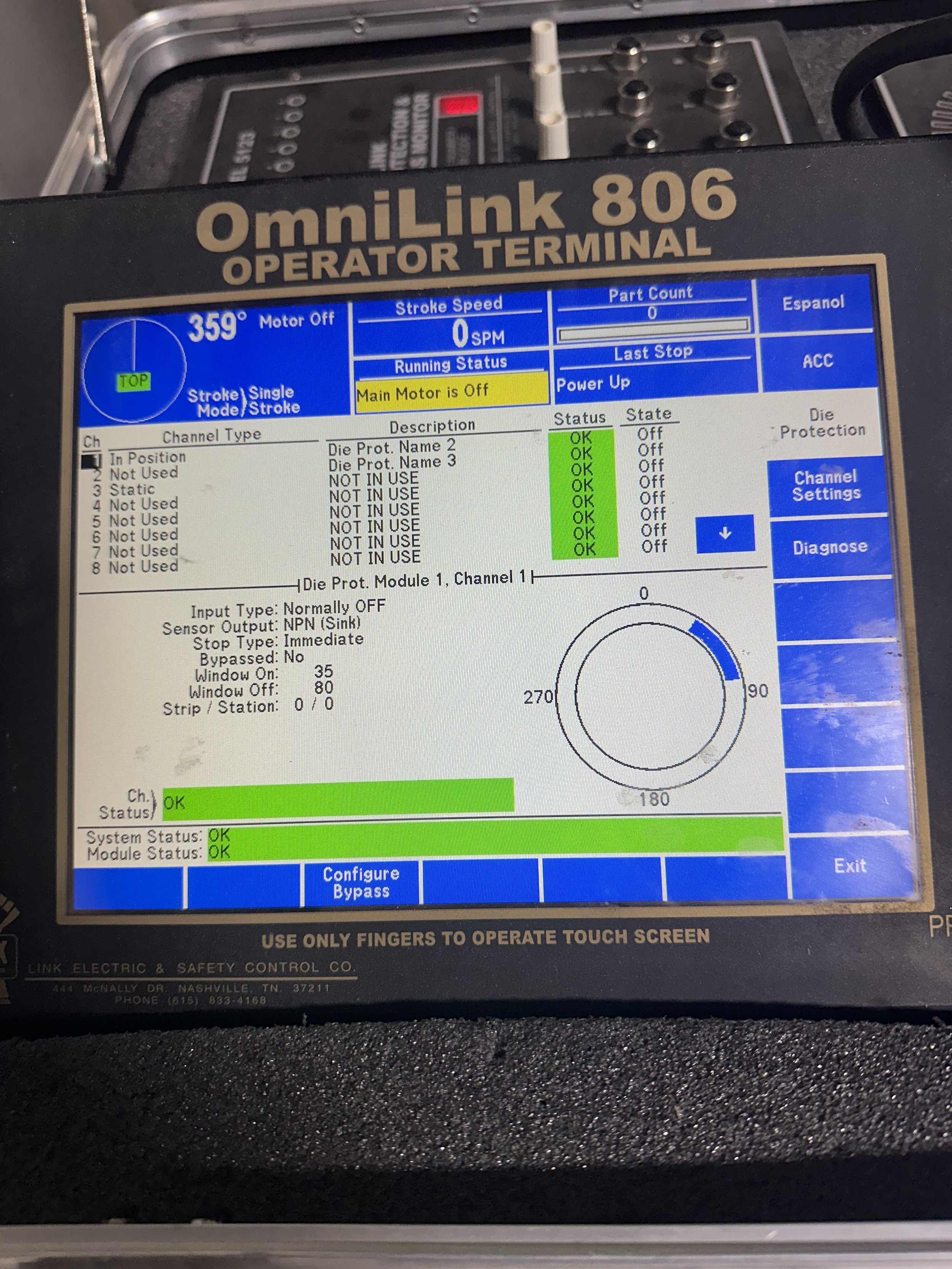 Display screen of an OmniLink 806 operator terminal showing system status as OK, Main Motor is Off, and various operational parameters.