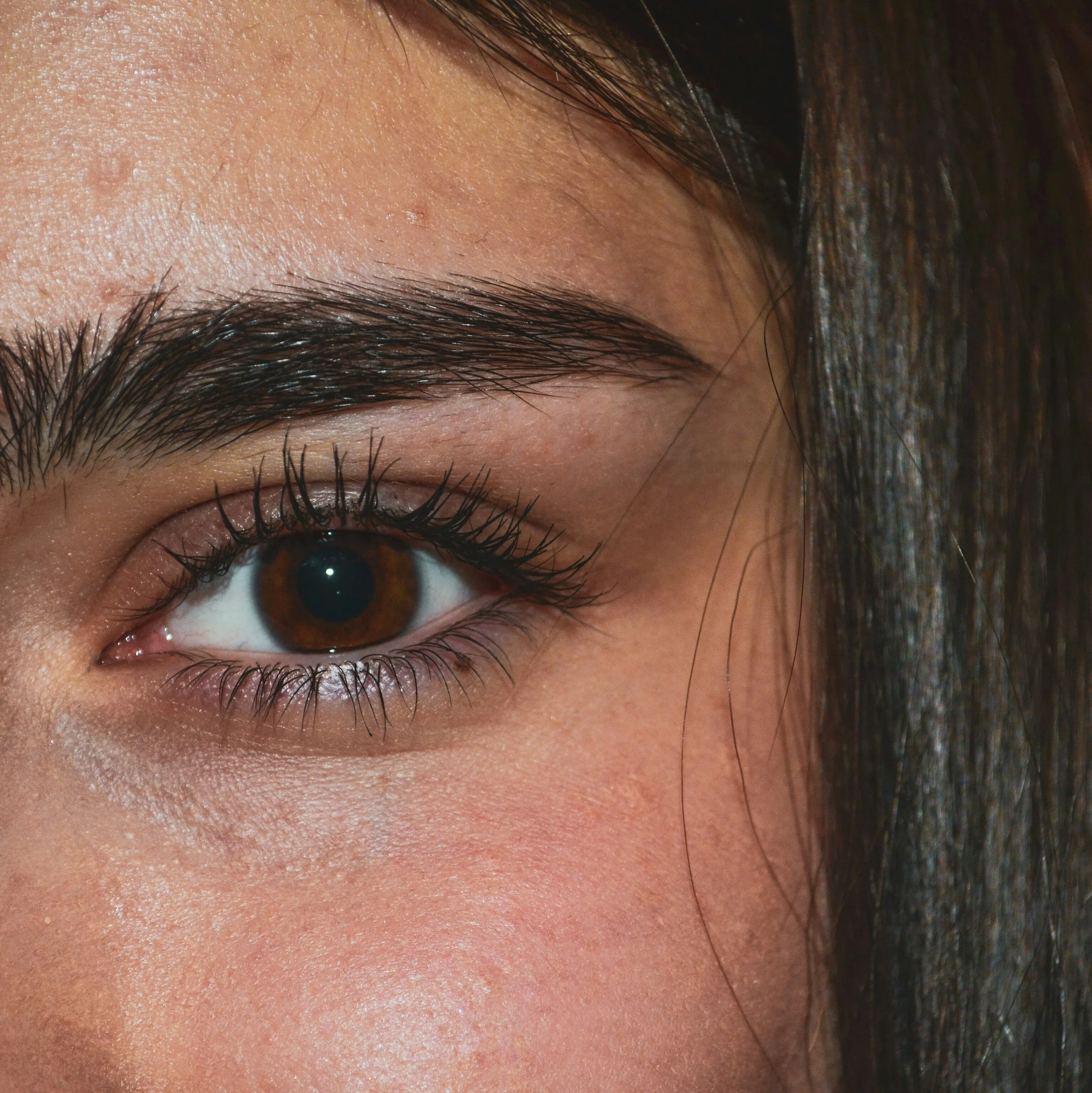 Symbolic image inspired by Frida Kahlo’s iconic brows — bold individuality, timeless expression.