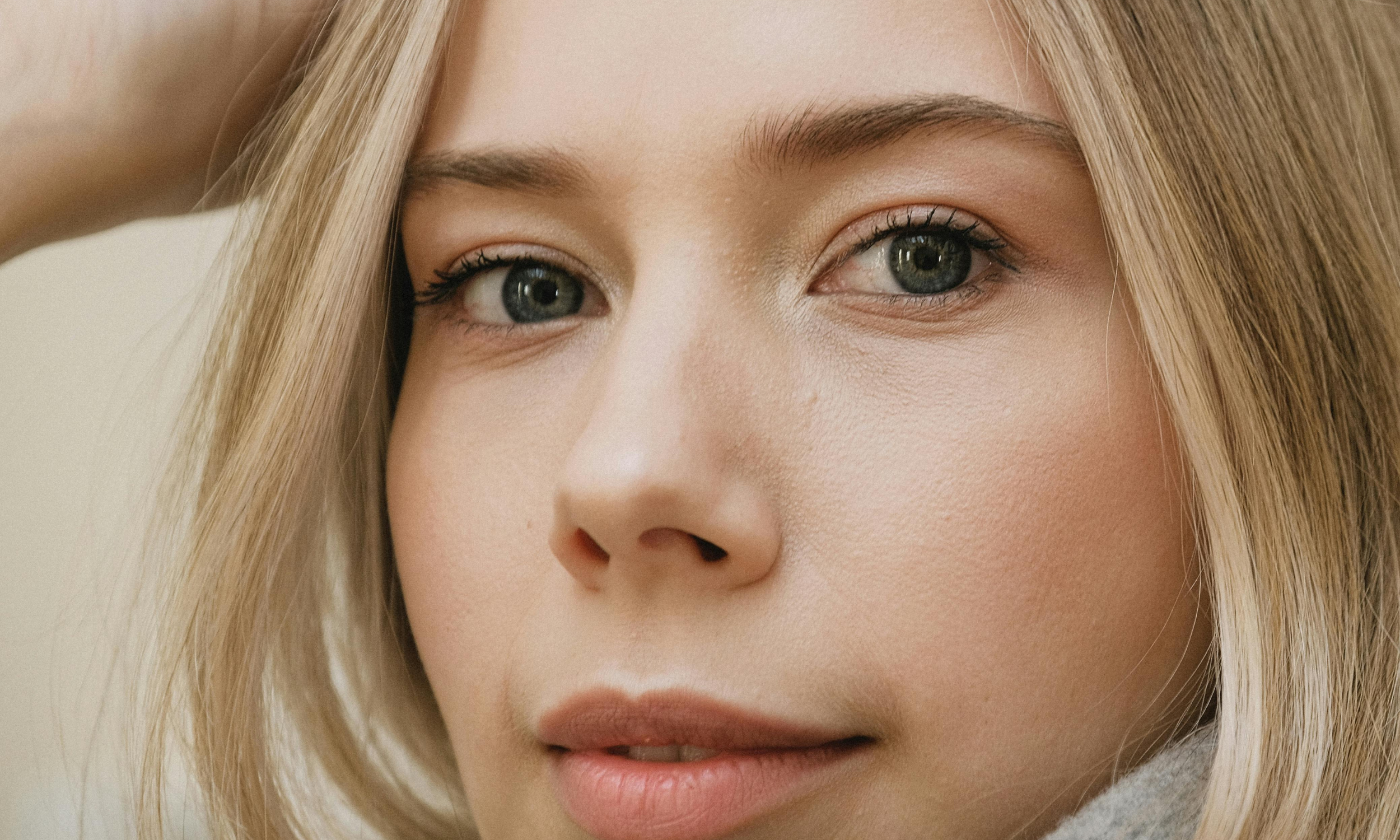 Close-up of natural brows and eyes showing balance, structure, and symmetry across the face.