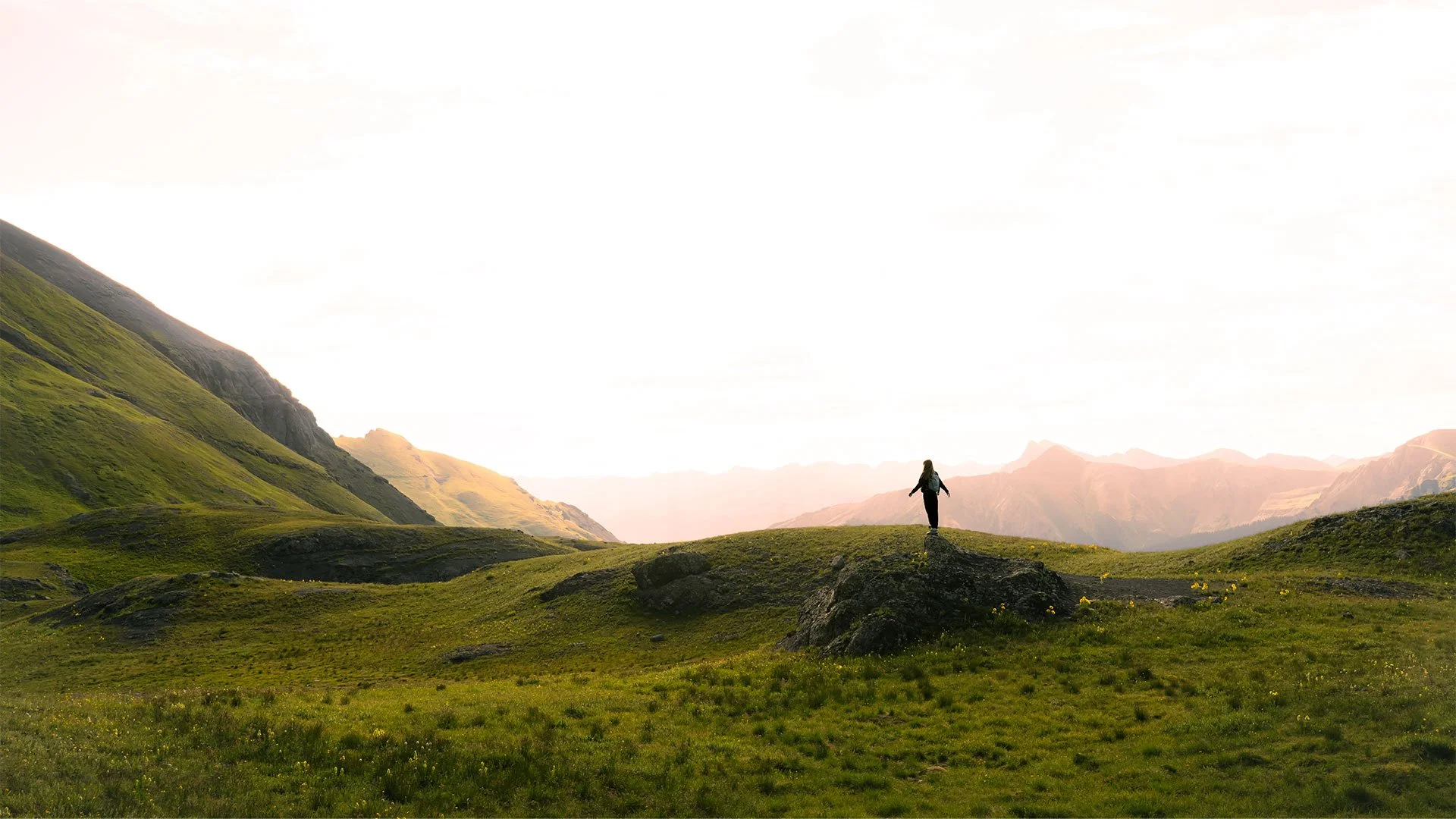 Hiker staring at a vista of mountains