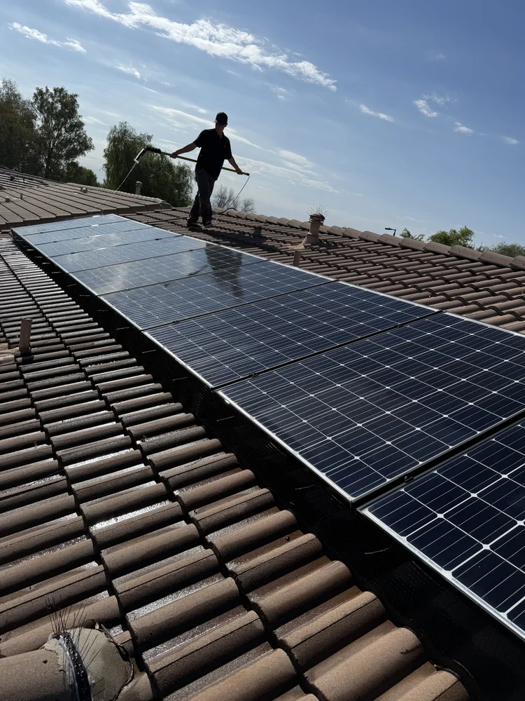 Solar panel cleaning on the job