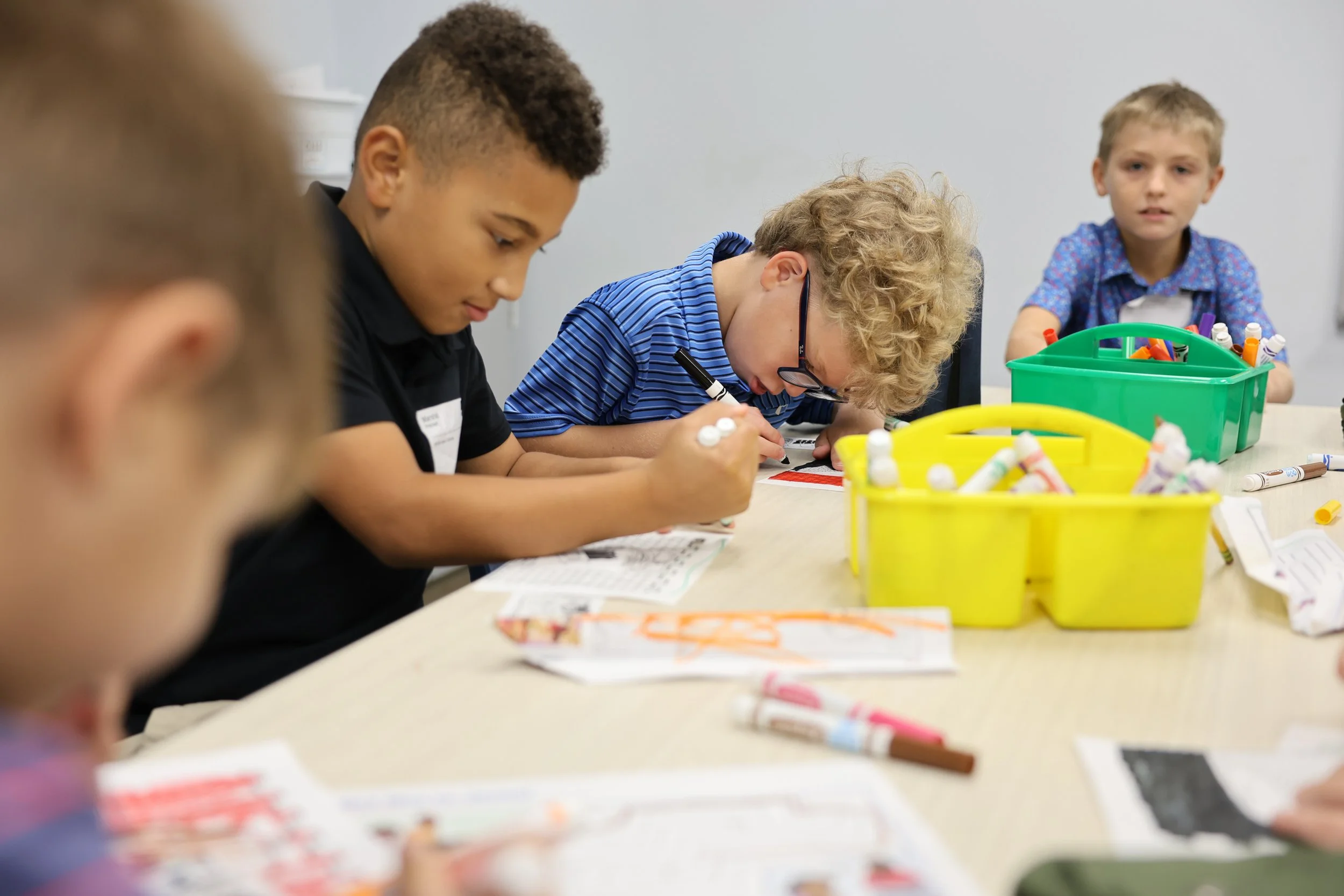 Kids learning more about the Bible through crafts.