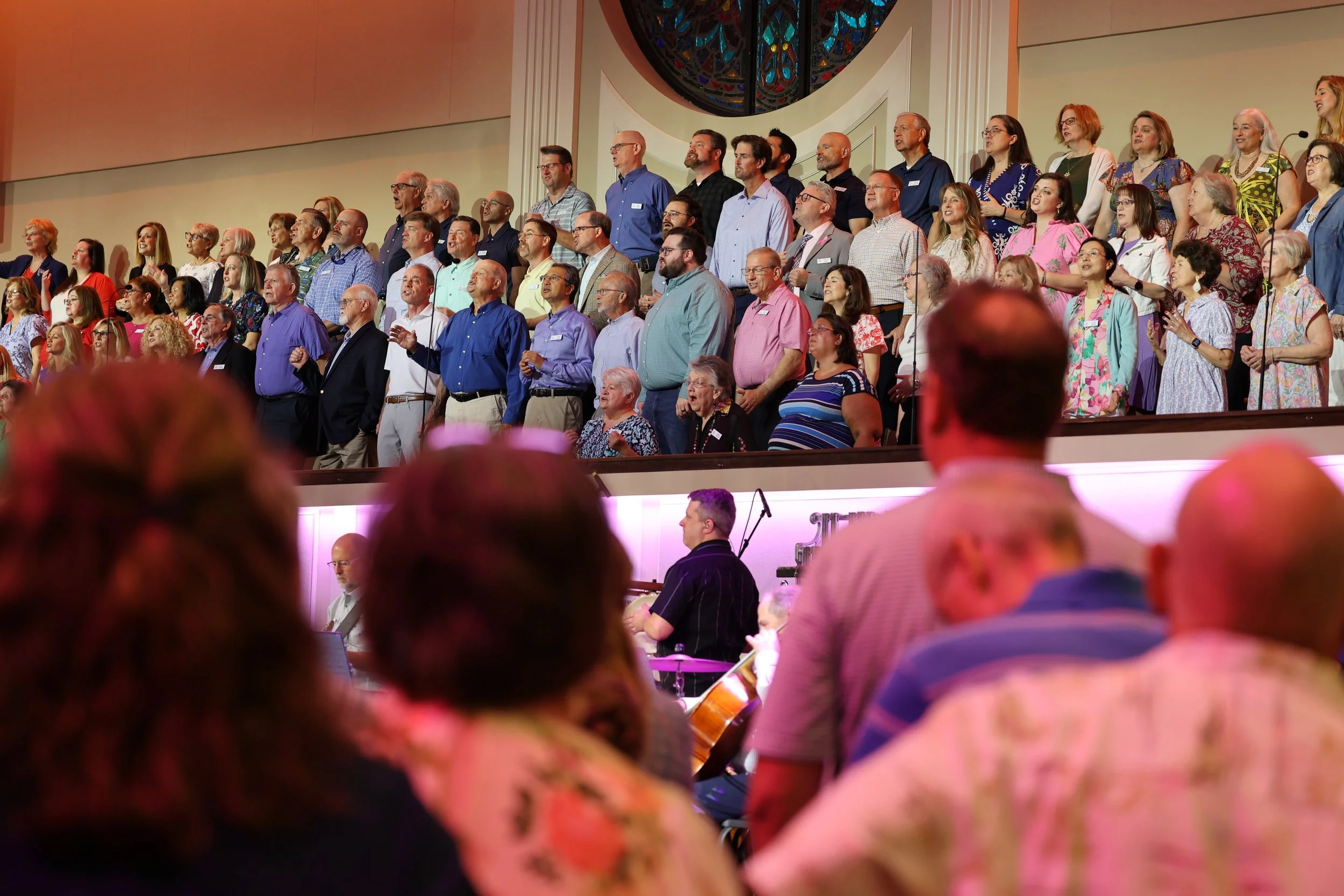 The congregation lifting their voices in worship.