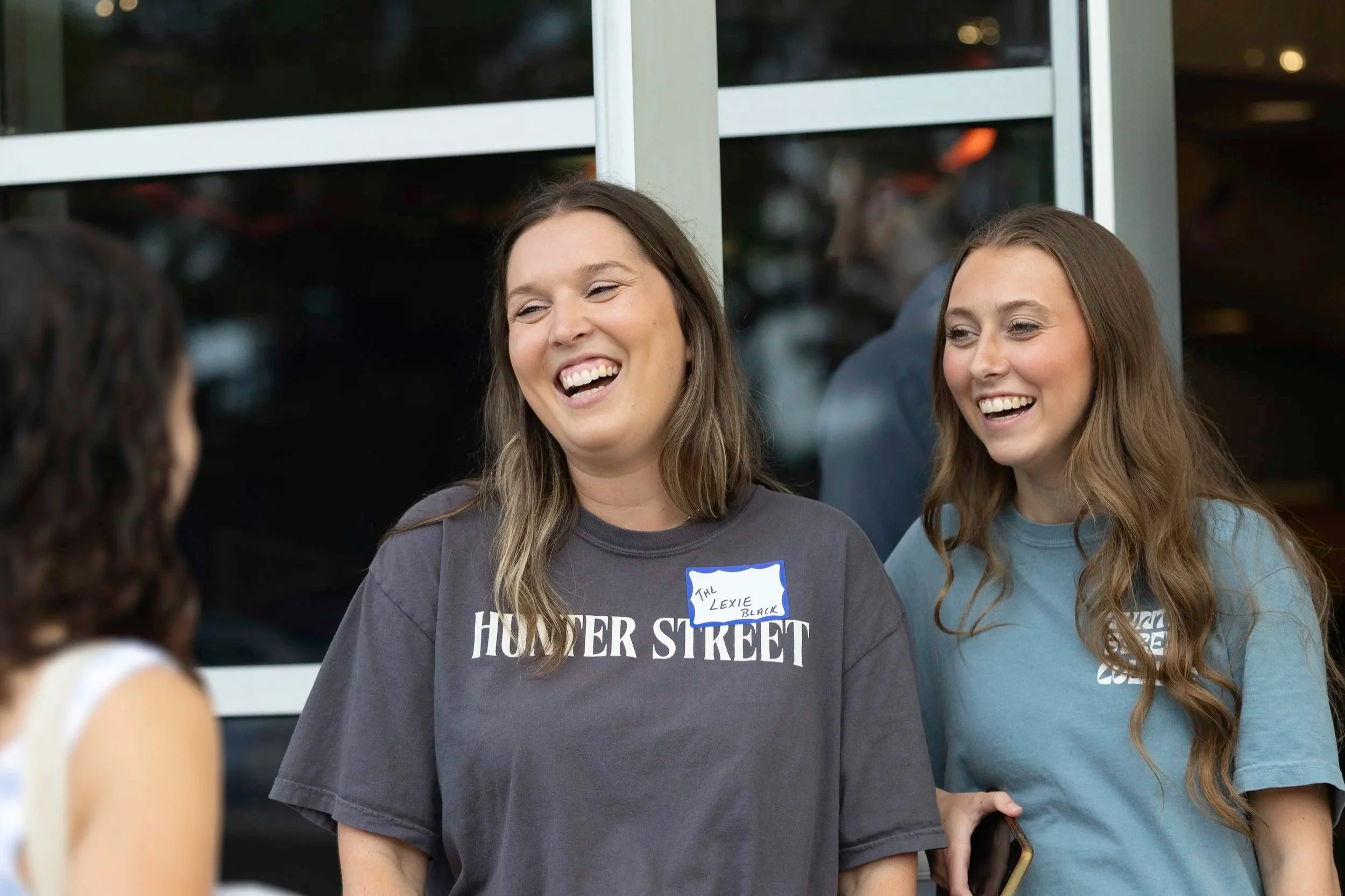 Young Adults greeting guests as they arrive.
