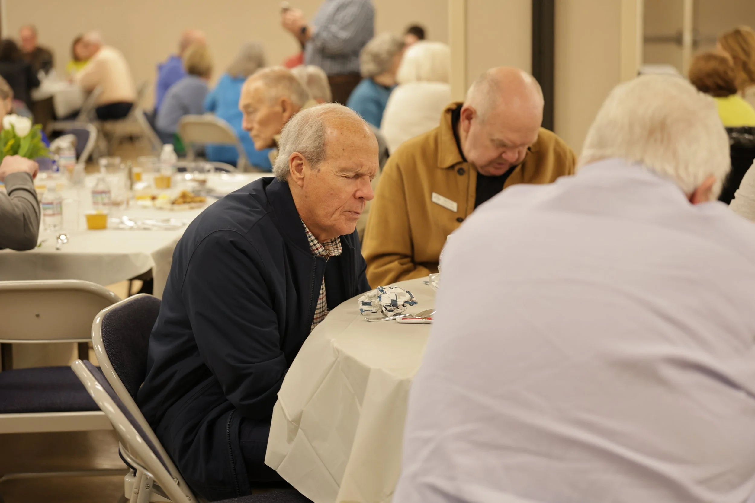 Senior Adults praying during a Bible study.