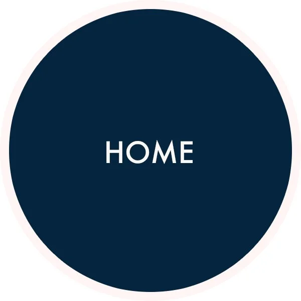 A navy blue circle with the word 'HOME' in white capital letters in the center.