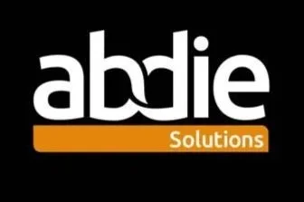 Logo for Abide Solutions featuring the company name with 'abide' in lowercase white letters and 'Solutions' in white on an orange background