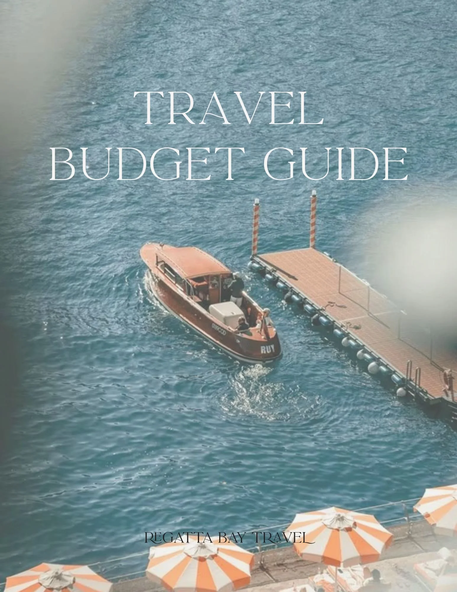 Travel budget guide cover with a boat on the water and orange and white striped umbrellas on the shoreline.